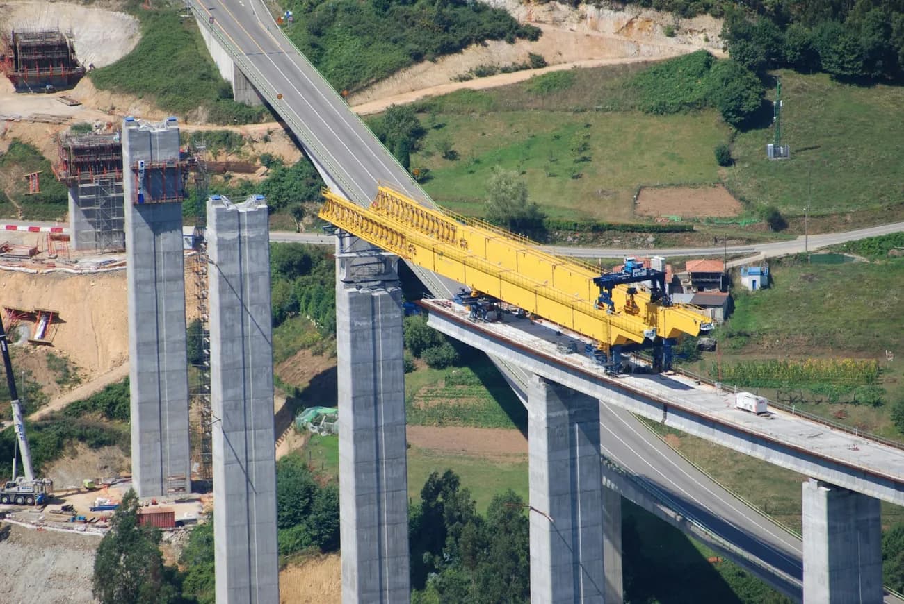 Bridge construction with yellow crane